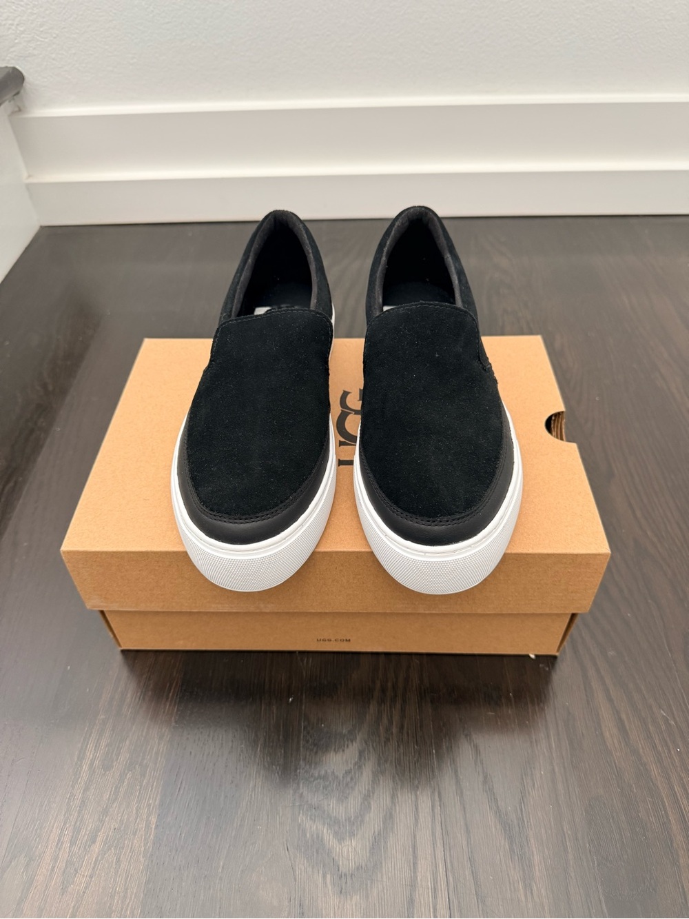 UGG Black Slip-On Suede Women’s Sneakers with White Platform Sole
